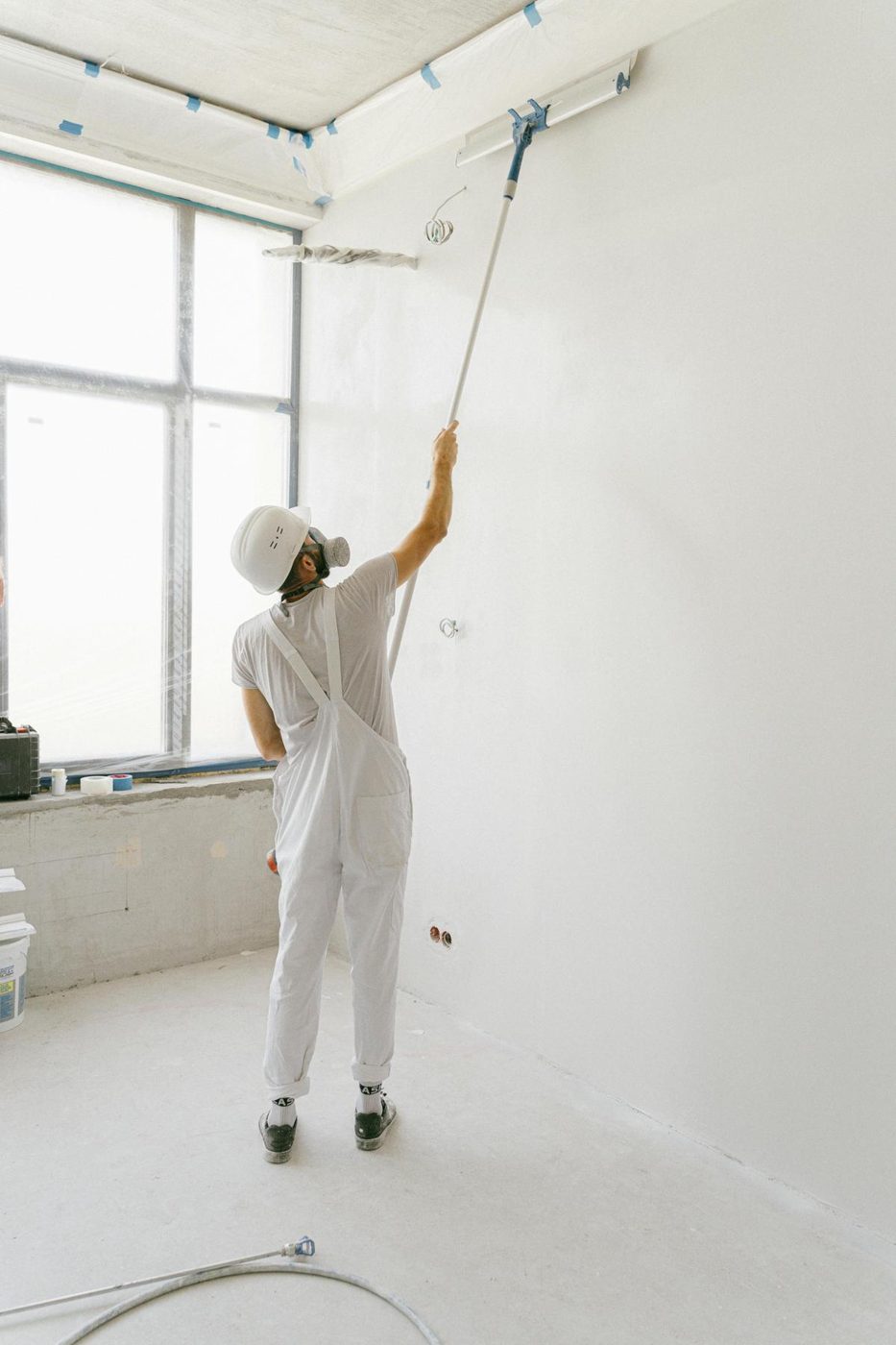 Painter rolling a ceiling