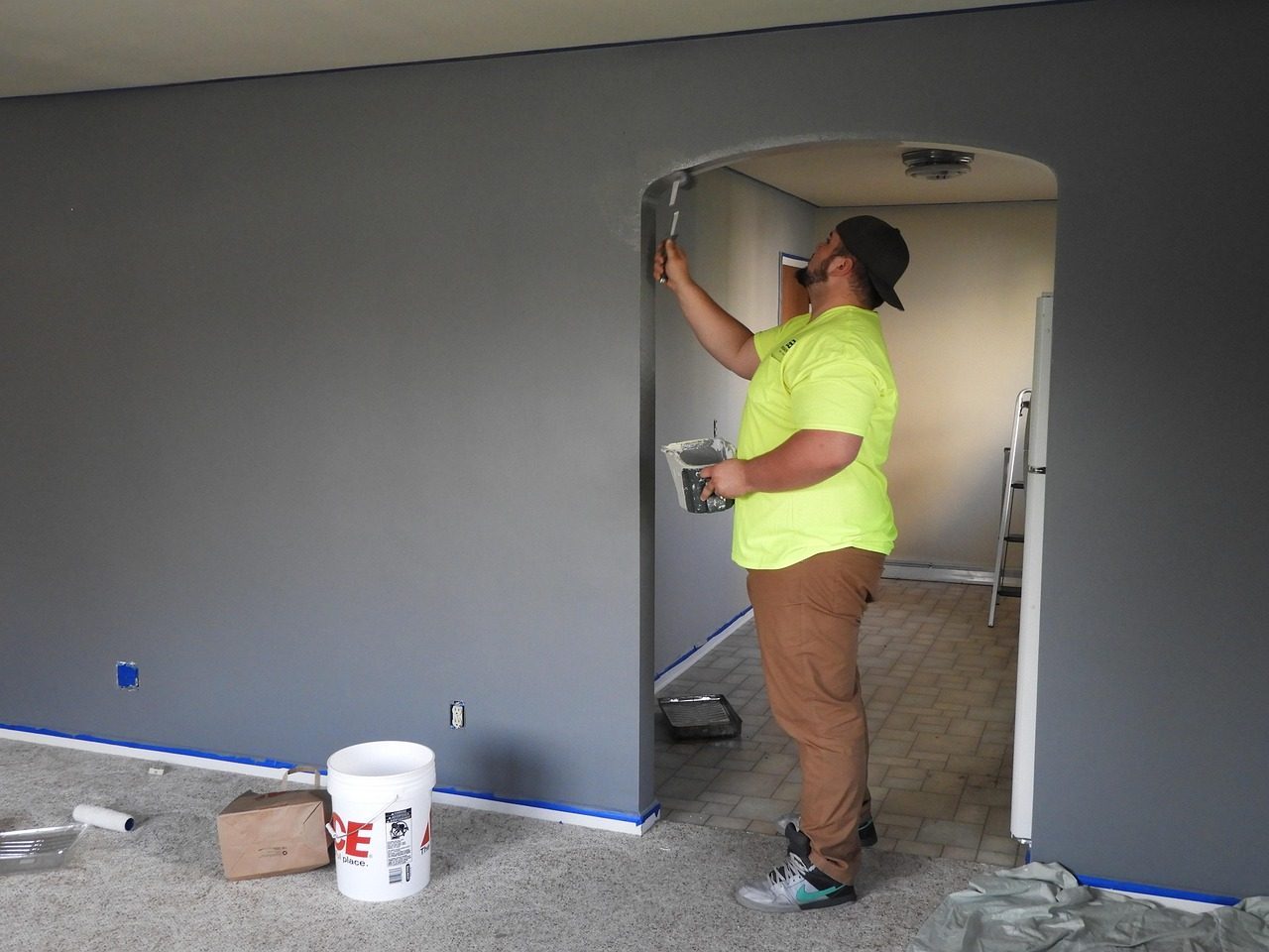 Painter finishing a door frame
